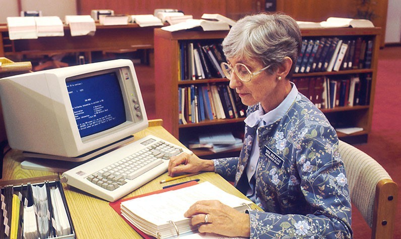 Woman Using IBM Computer